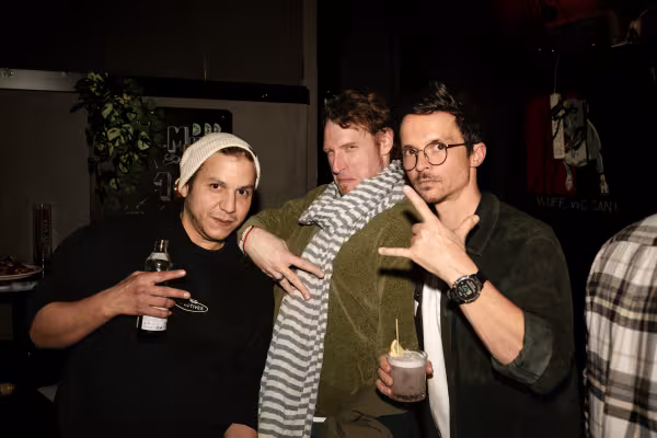 Gang signs with three people