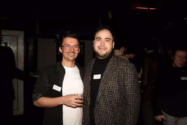 Two people laughing at the camera